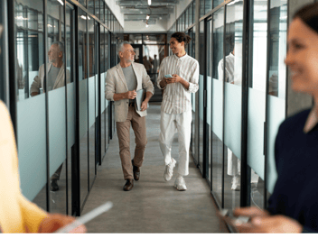 Co-workers walking down a corridor