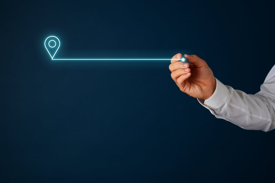 Image of a hand with a neon line and address icon