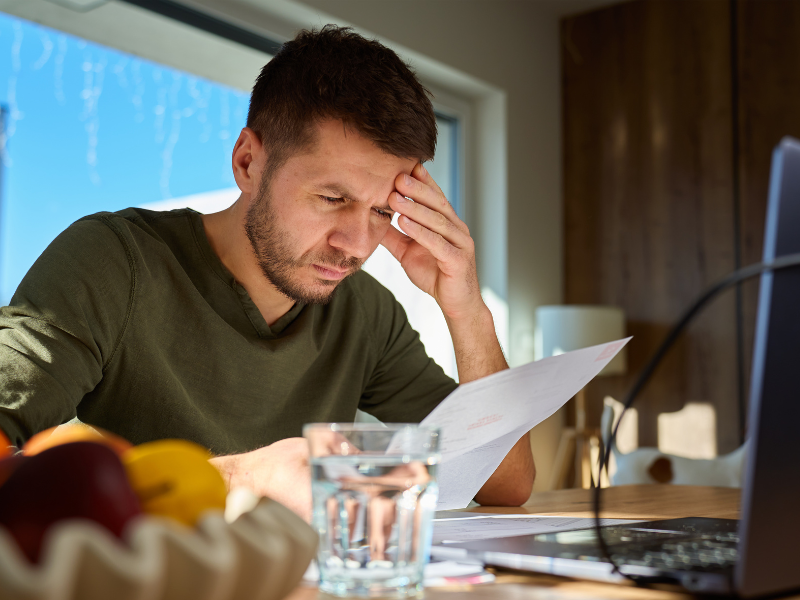 A person reading a piece of paper